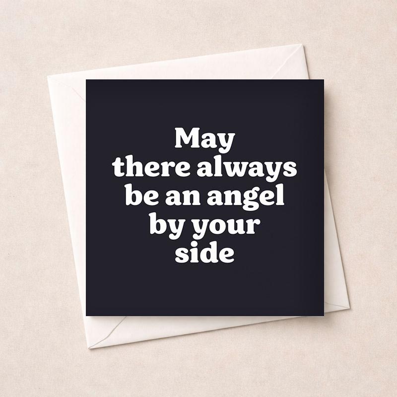 Black greetings card with white quote "May there always be an angel by your side" for comfort and reassurance.