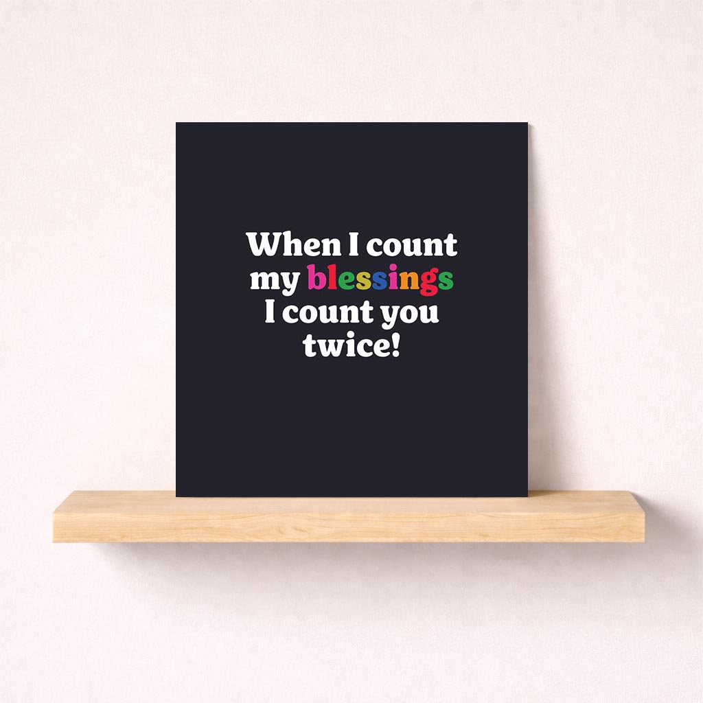 Heartwarming card: "When I count my blessings I count you twice!" Elegant black background with colorful text. Perfect for expressing love and gratitude.
