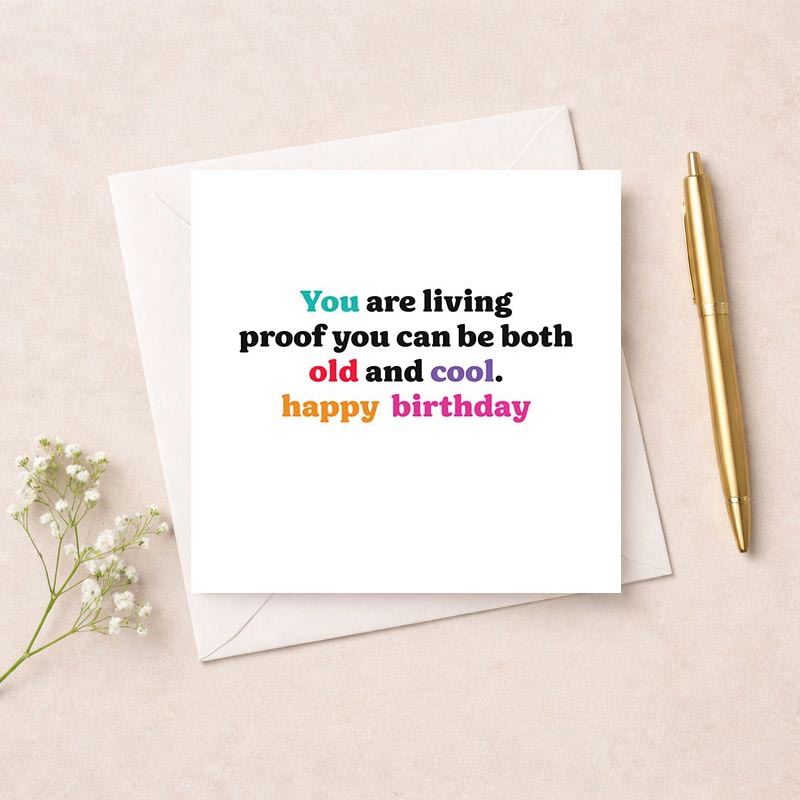 Colorful birthday card with cake, candle, and "You are living proof you can be both old and cool. Happy birthday" greetings.