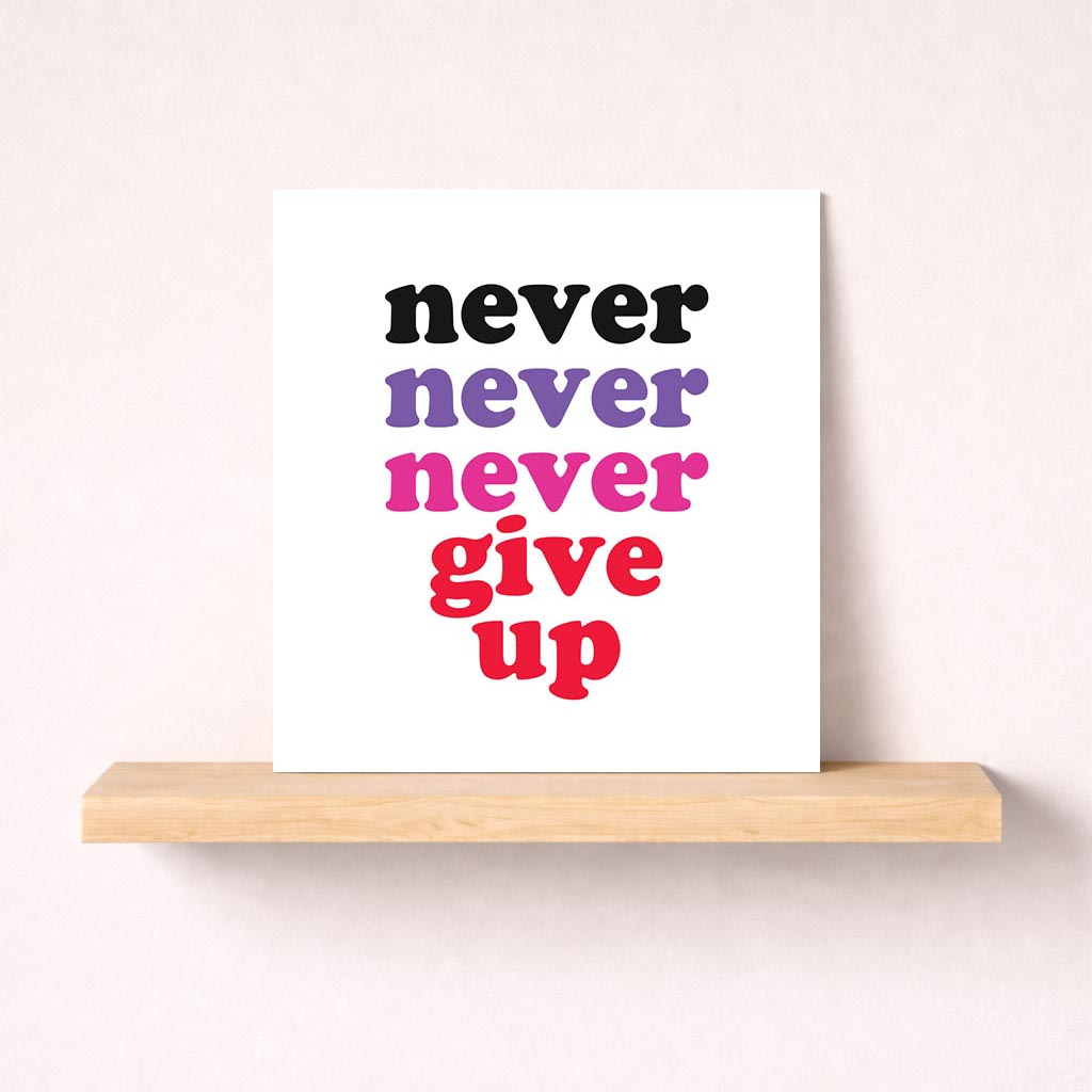 A motivational greetings card with quote "never never give up" in pink and red colors, perfect for inspiring friends and family.