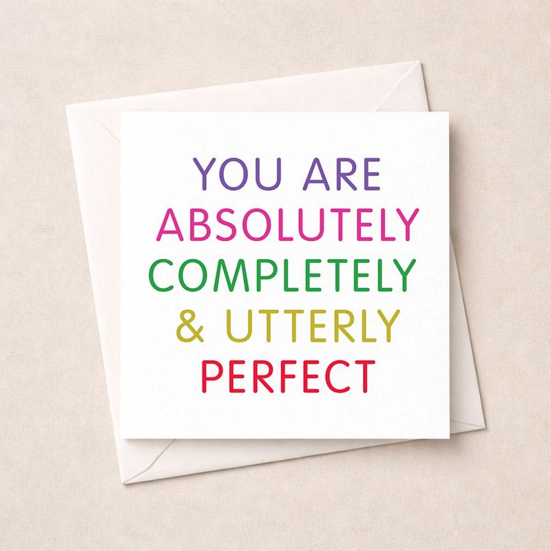 Vibrant greetings card with bold text: "YOU ARE ABSOLUTELY COMPLETELY &amp; UTTERLY PERFECT" - a heartwarming message of worth and uniqueness, ideal for spreading joy and positivity.