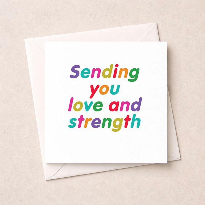 Colorful greetings card with rainbow heart, reads "Sending you love and strength" for support and encouragement.