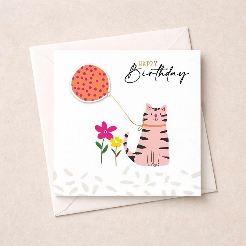 Cheerful greetings card with cute cat holding balloon and flower on pink and orange pattern. Ideal for cat lovers and anyone who appreciates sweet designs.