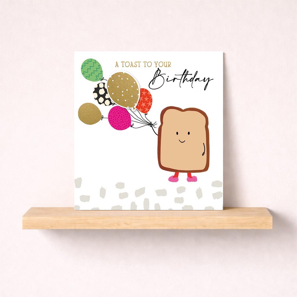 Cheerful birthday card with toast and balloons, perfect for spreading joy and whimsy.