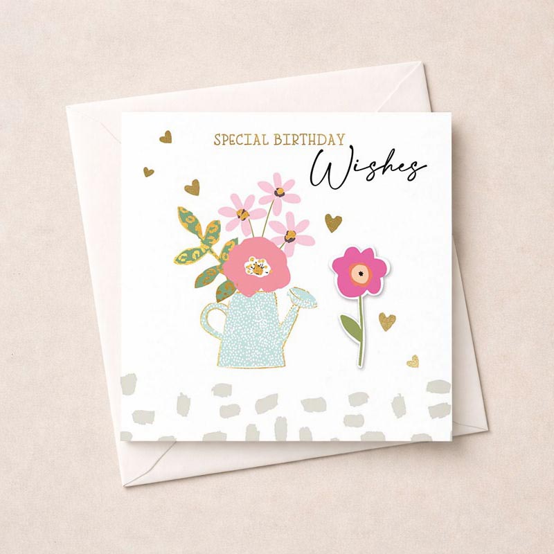 Charming greetings card with flowers and watering can, perfect for birthdays or to spread cheer to a loved one.