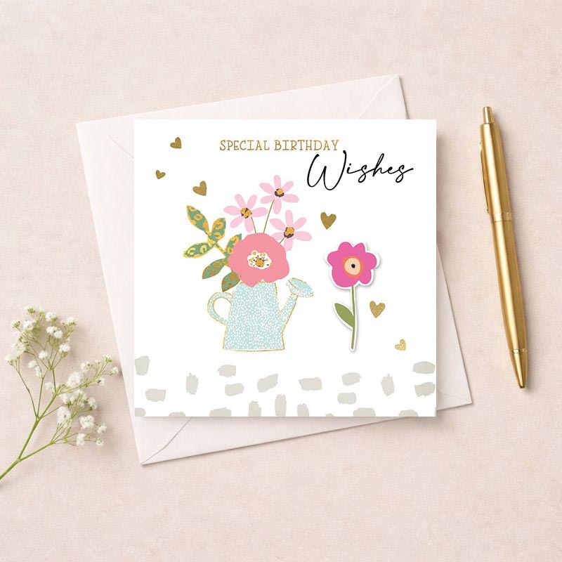 Charming greetings card with flowers and watering can, perfect for birthdays or to spread cheer to a loved one.