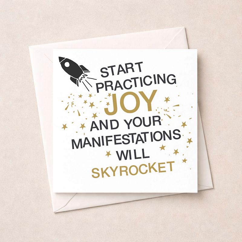 Vibrant greetings card with rocket design and gold accents, featuring inspiring sentiment "Start practicing joy and your manifestations will skyrocket". Perfect for spreading positivity and happiness to a loved one.