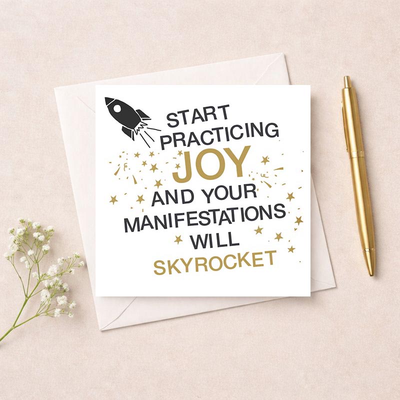 Vibrant greetings card with rocket design and gold accents, featuring inspiring sentiment "Start practicing joy and your manifestations will skyrocket". Perfect for spreading positivity and happiness to a loved one.