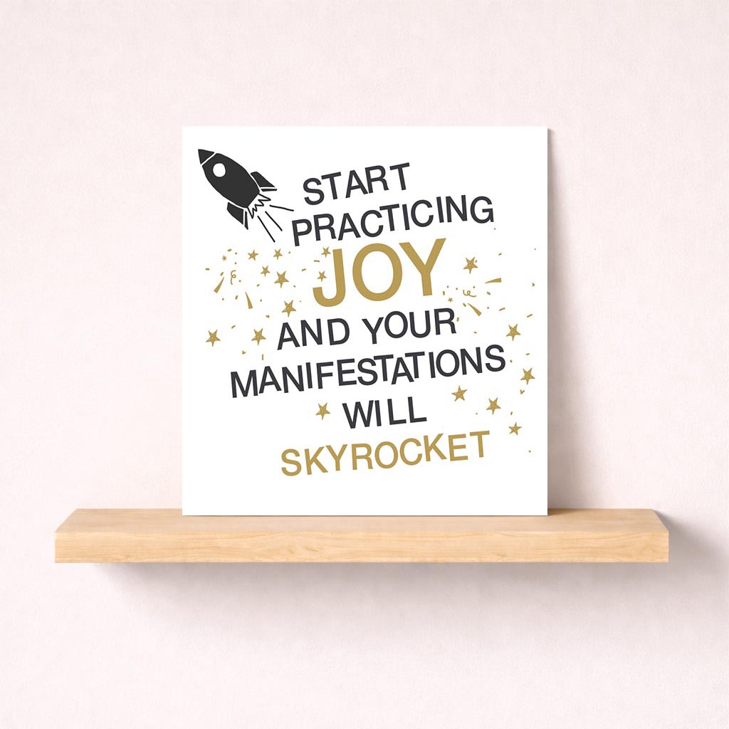 Vibrant greetings card with rocket design and gold accents, featuring inspiring sentiment "Start practicing joy and your manifestations will skyrocket". Perfect for spreading positivity and happiness to a loved one.