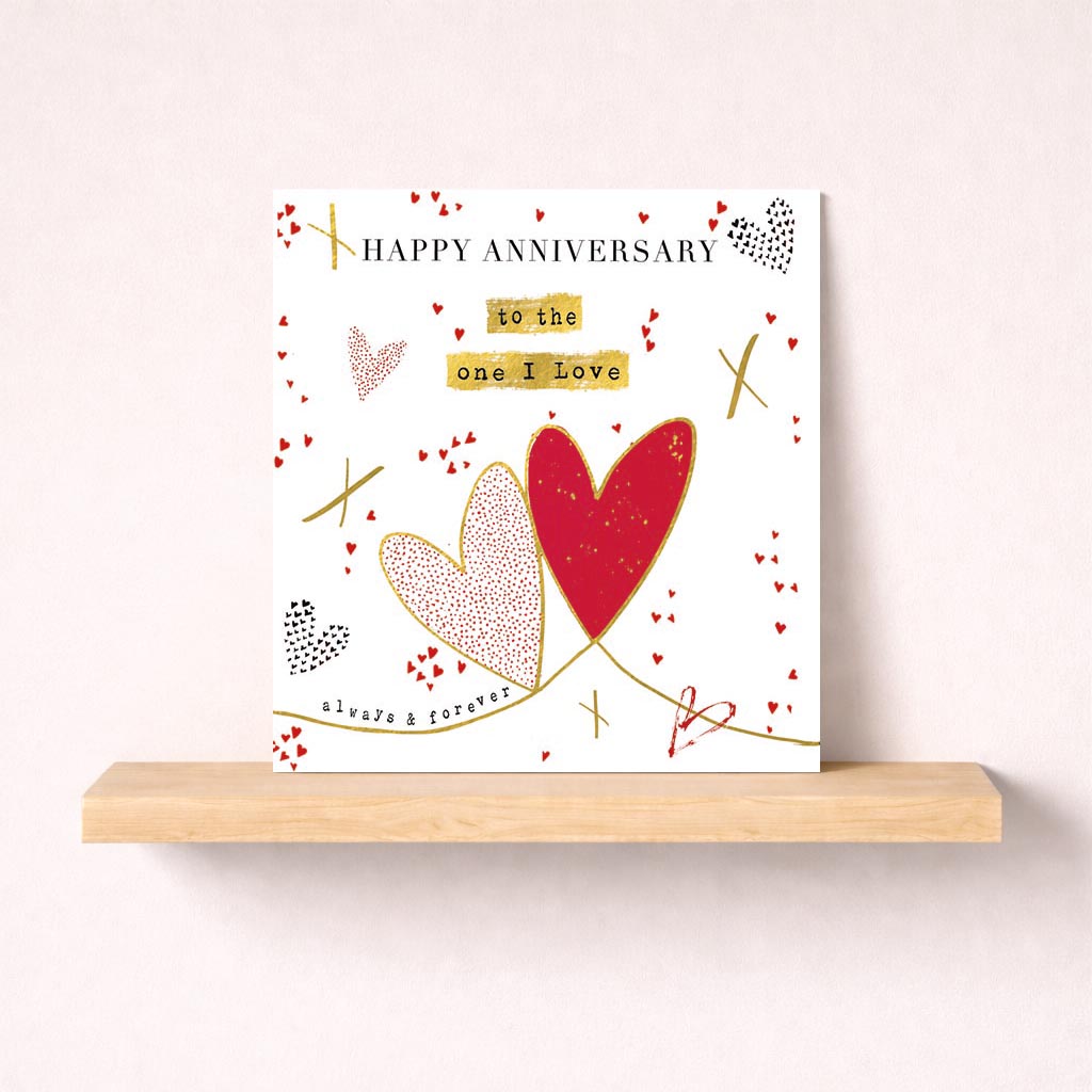 White greetings card with two hearts, perfect for expressing love on anniversaries or special occasions. Classic and elegant design suitable for all ages.