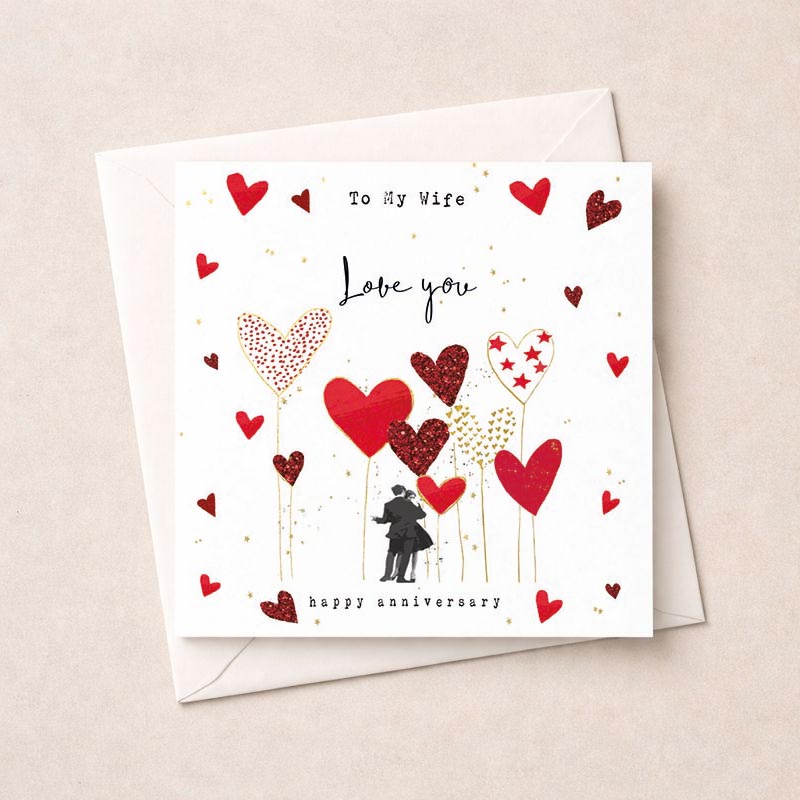 Romantic greetings card with couple surrounded by hearts, perfect for Valentine's Day or anniversary. Ideal for expressing love to a special someone.