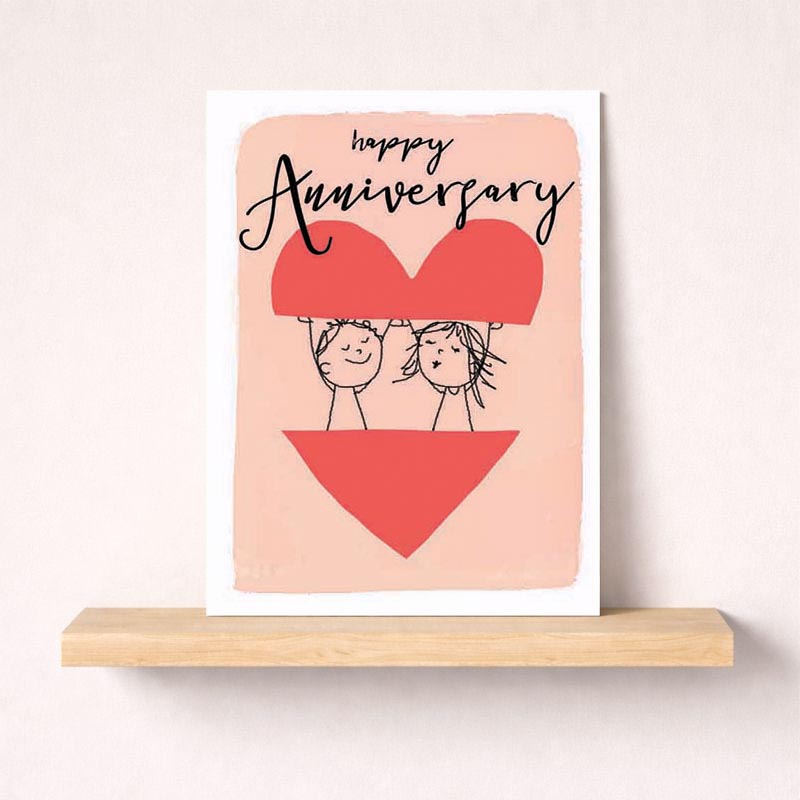 A sweet anniversary card with a couple holding a heart, perfect for expressing love and gratitude. Ideal for young and young-at-heart couples.