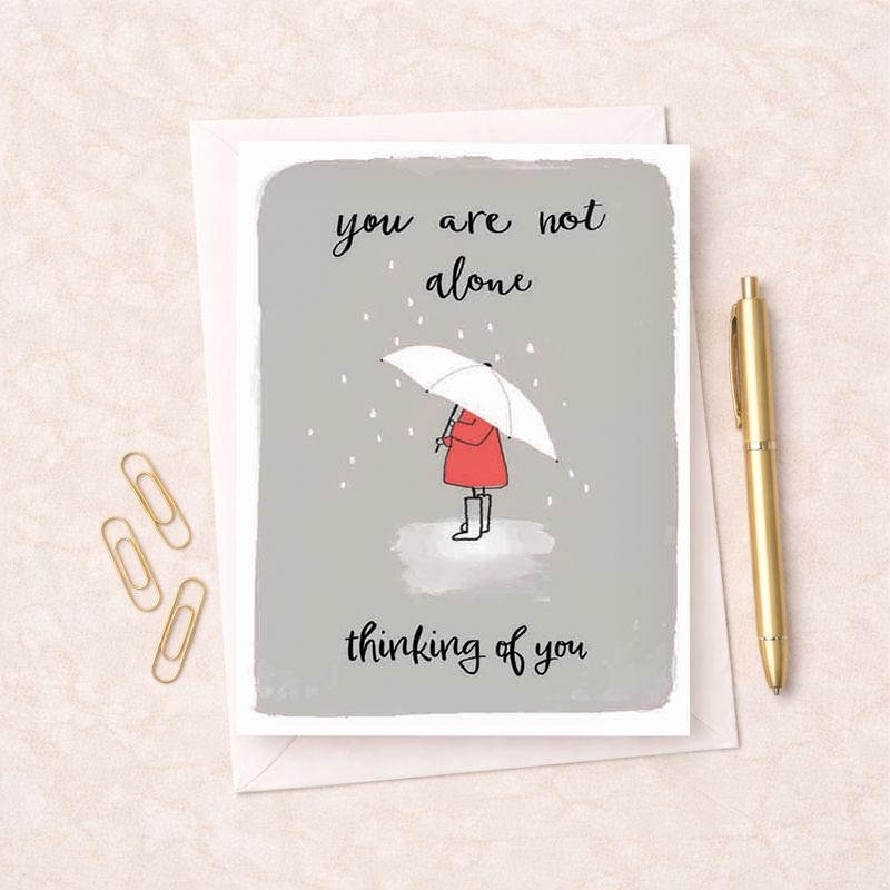 Heartfelt card with message "you are not alone, thinking of you" for support during tough times.
