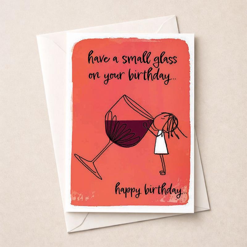 A girl holding a glass of wine on a birthday greetings card.