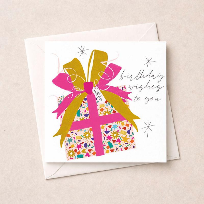 Pink gift on pink background, perfect for spreading joy and love with birthday wishes.