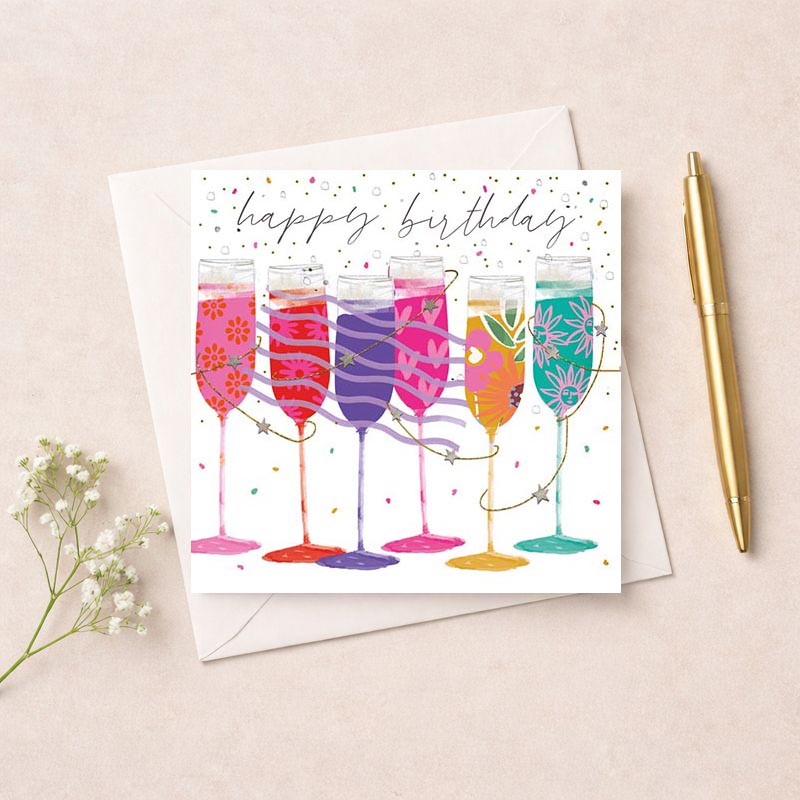 Charming greetings card with four champagne glasses, perfect for special occasions. Celebrate in style!
