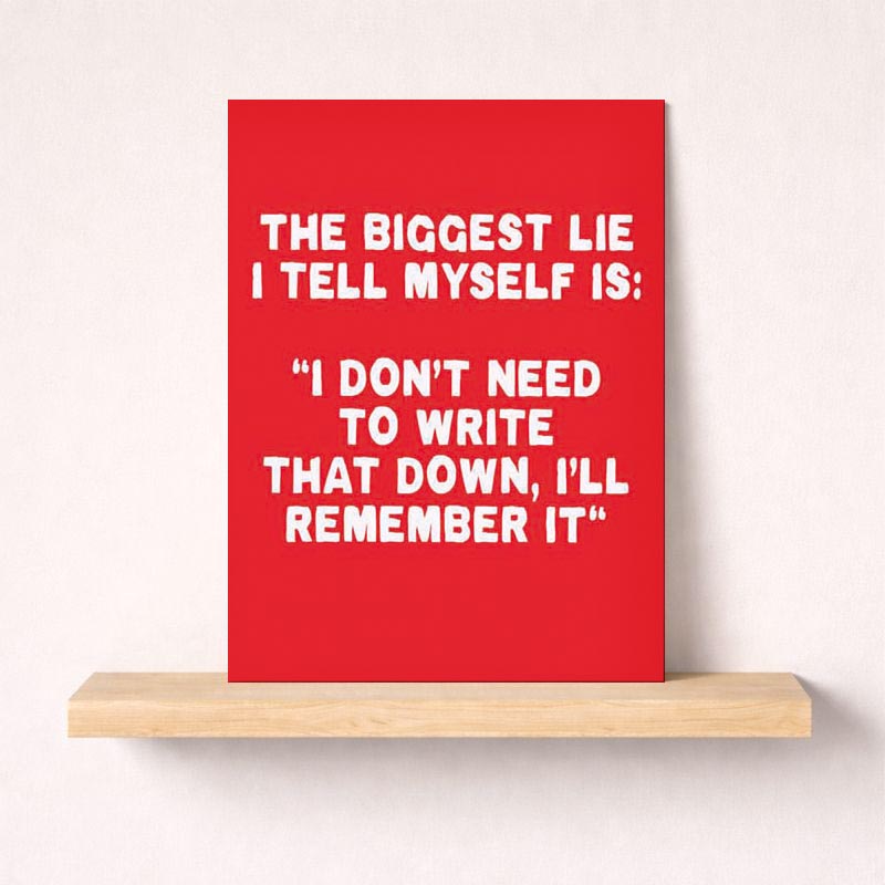 Red poster with quote: "THE BIGGEST LIE I TELL MYSELF IS: 'I DON'T NEED TO WRITE THAT DOWN, I'LL REMEMBER IT'" Perfect for staying organized and focused.